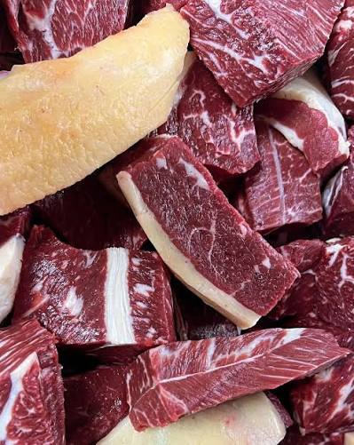 Freshly cubed marbled beef ready for stews